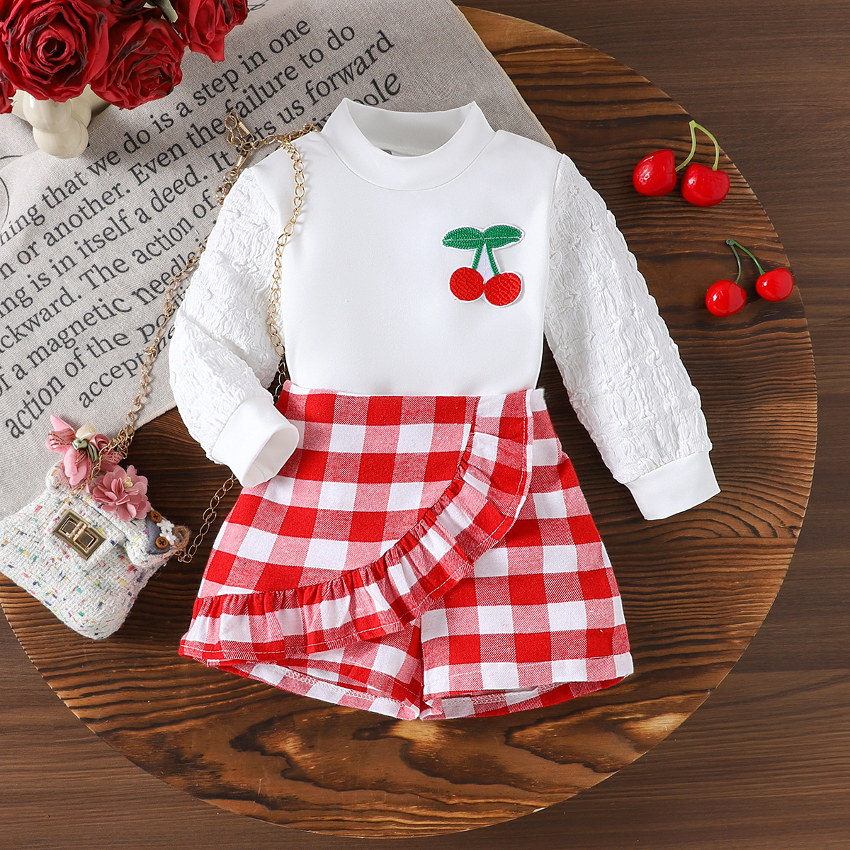 Cross border European and American casual spring and autumn girls' cherry patterned long sleeved top paired with red checkered shorts set
