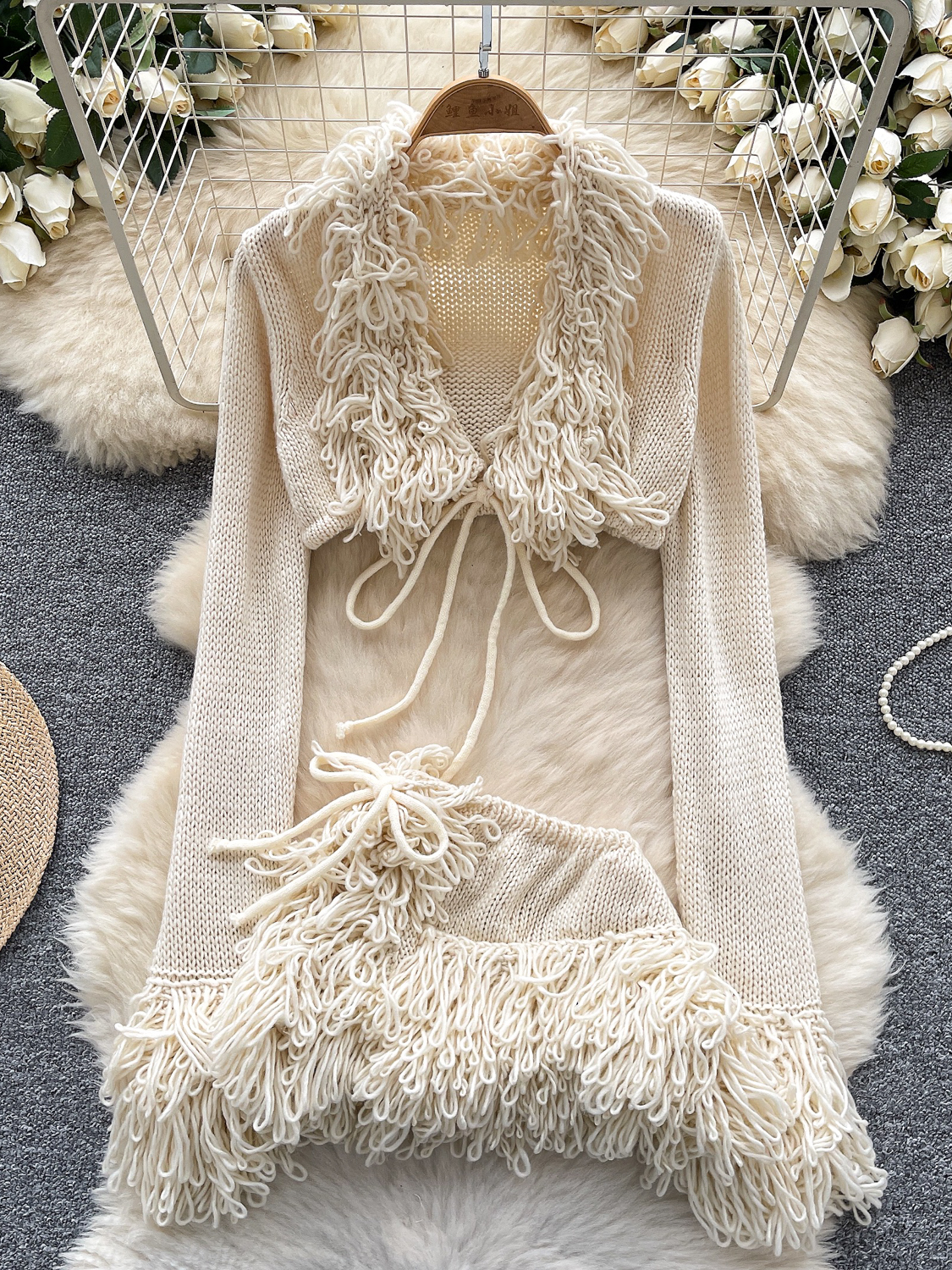 Knitted suit for women, European and American sexy spicy girl, V-neck strap, long sleeved short cut, rough edge cover, high waisted irregular short skirt