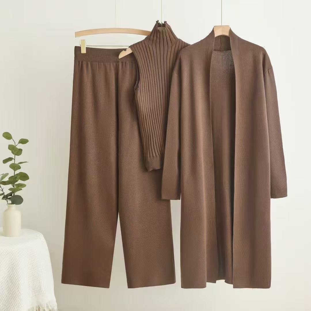 Autumn and winter goddess style long windbreaker, high neck, inner vest, sweater, elastic waist, wide leg pants, knitted three piece set Autumn and winter goddess style long windbreaker, high neck, inner vest, sweater, elastic waist, wide leg pants, knitted three piece set