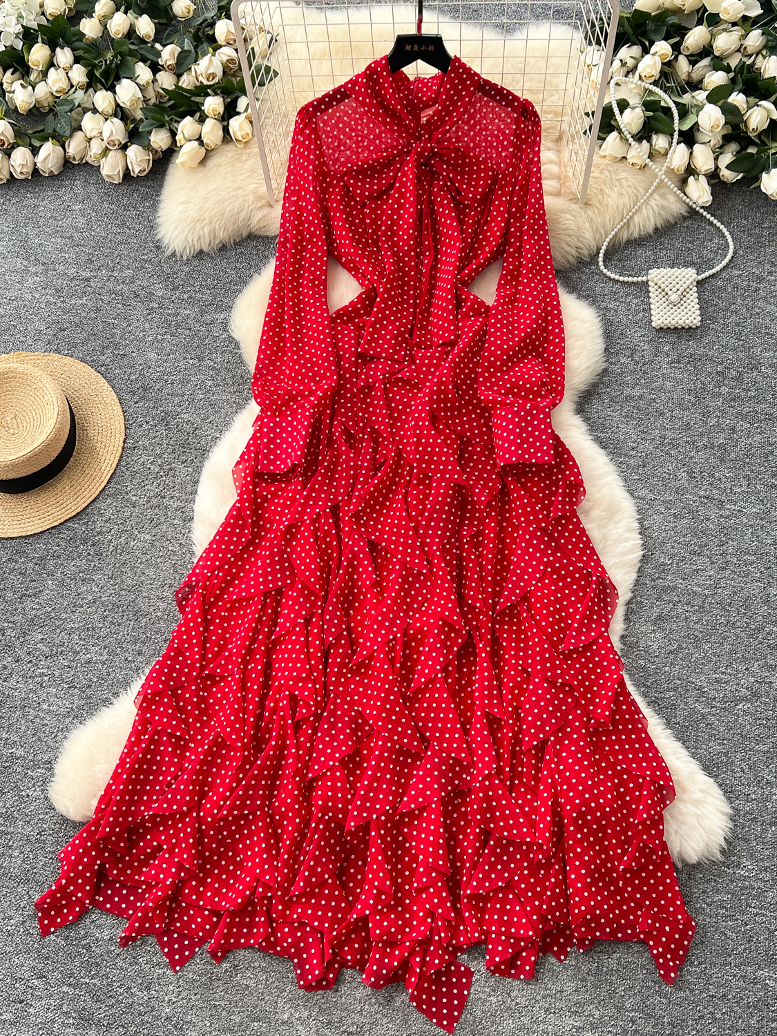 Light mature style niche bow tie tied long sleeved polka dot dress for women in autumn 2025, irregular lotus leaf side length skirt