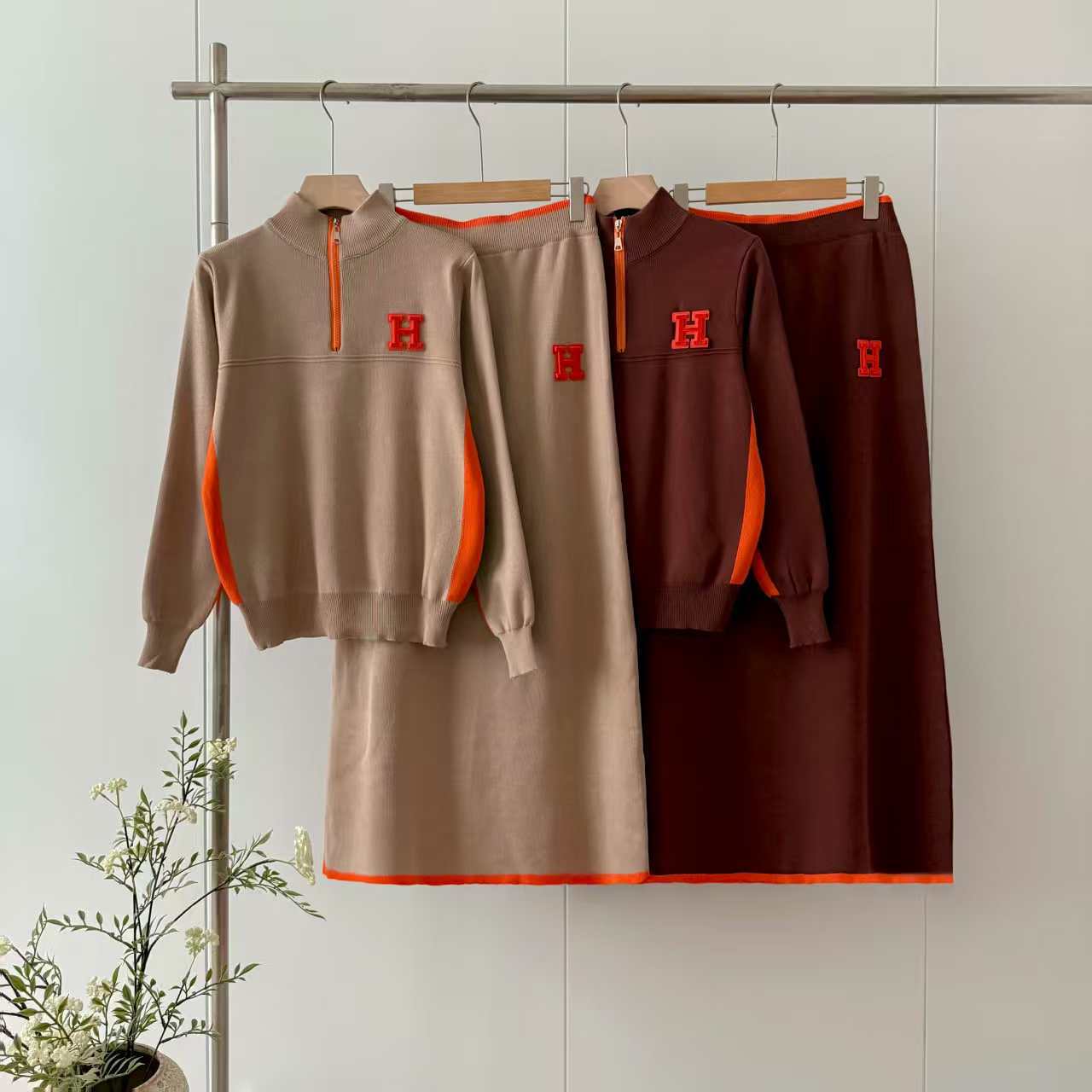 European and American women's casual sports zipper stand up collar long sleeved top, letter long skirt knitted two-piece set