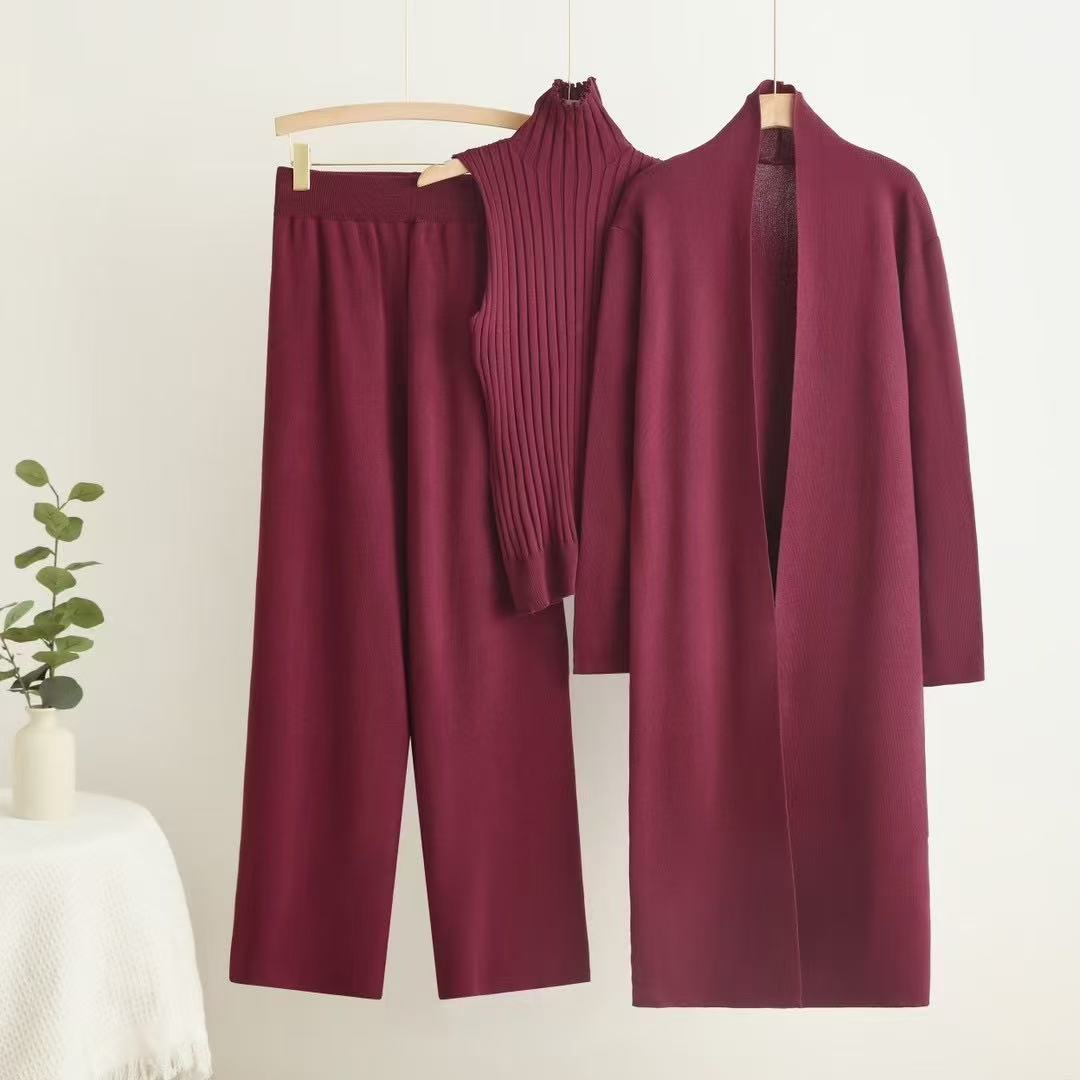 Autumn and winter goddess style long windbreaker, high neck, inner vest, sweater, elastic waist, wide leg pants, knitted three piece set Autumn and winter goddess style long windbreaker, high neck, inner vest, sweater, elastic waist, wide leg pants, knitted three piece set
