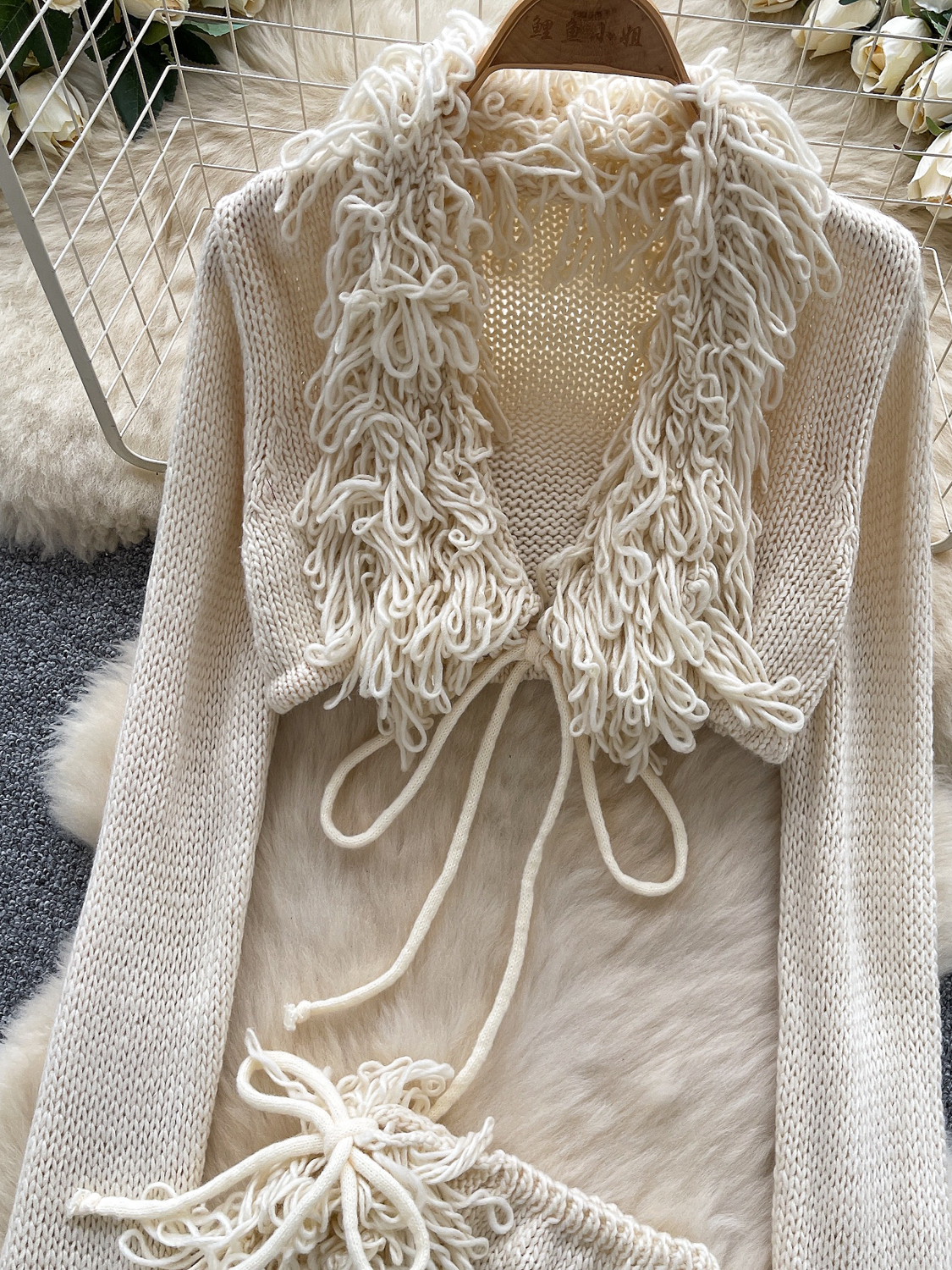 Knitted suit for women, European and American sexy spicy girl, V-neck strap, long sleeved short cut, rough edge cover, high waisted irregular short skirt Knitted suit for women, European and American sexy spicy girl, V-neck strap, long sleeved short cut, rough edge cover, high waisted irregular short skirt