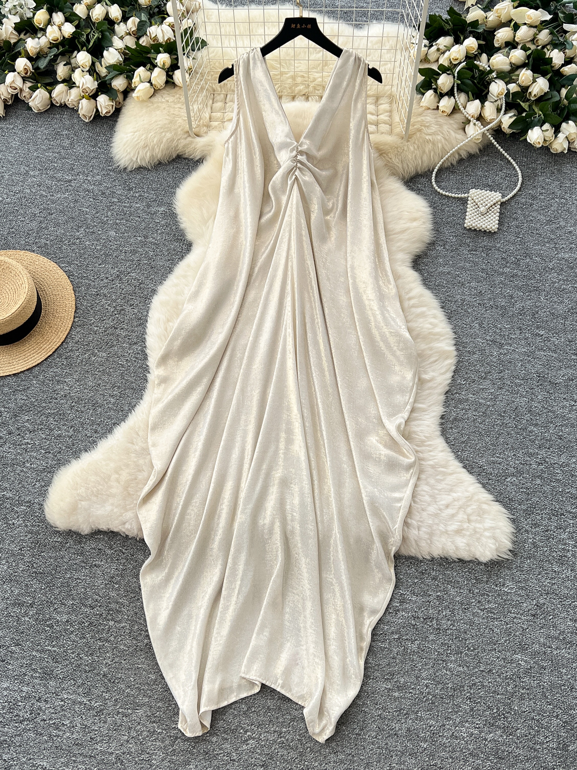 Atmosphere vacation style dress for women, summer French temperament, V-neck pleated sleeveless loose irregular long skirt