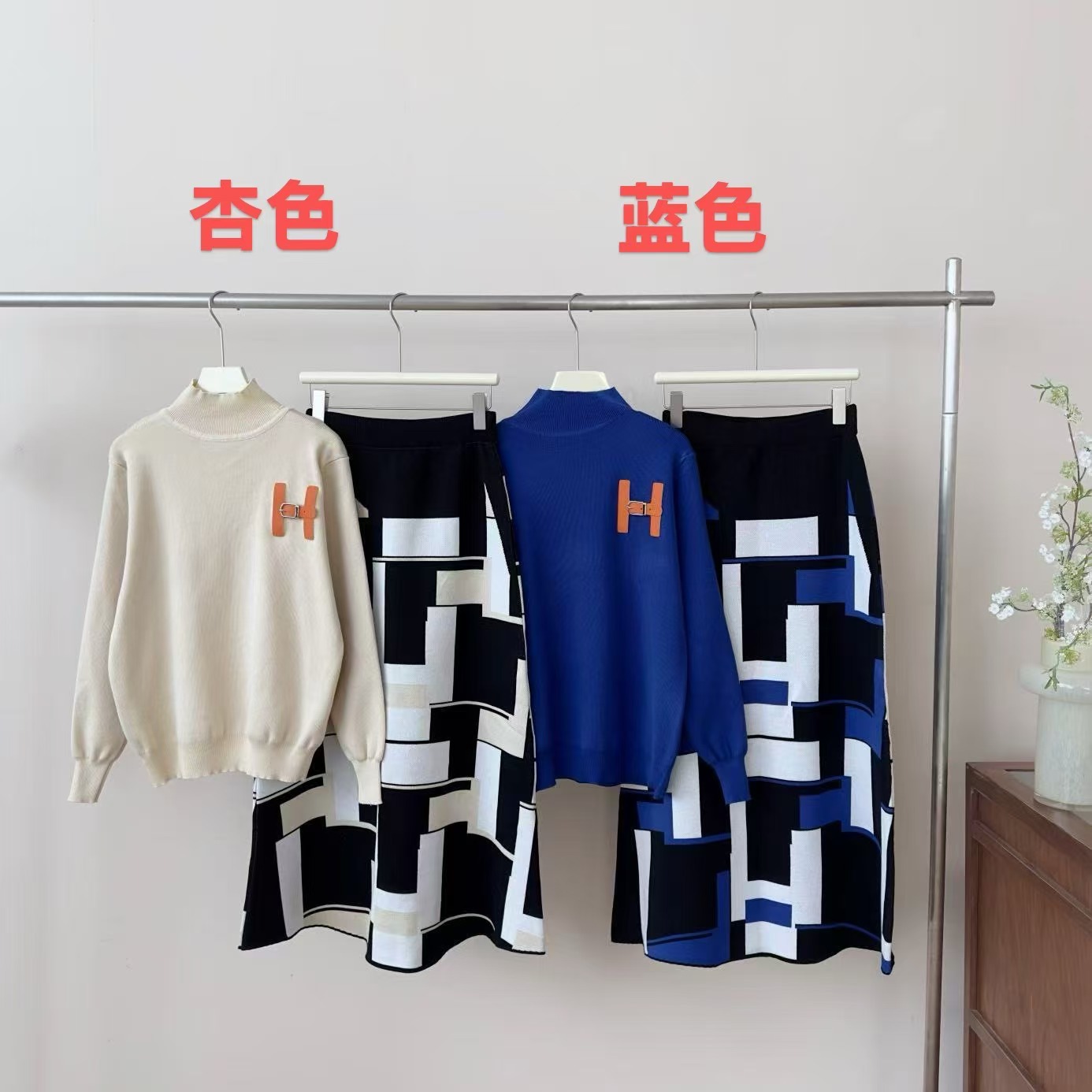 European fashion and high-end casual knitted sweater set for women's winter anti-aging letter half body long skirt two-piece set European fashion and high-end casual knitted sweater set for women's winter anti-aging letter half body long skirt two-piece set