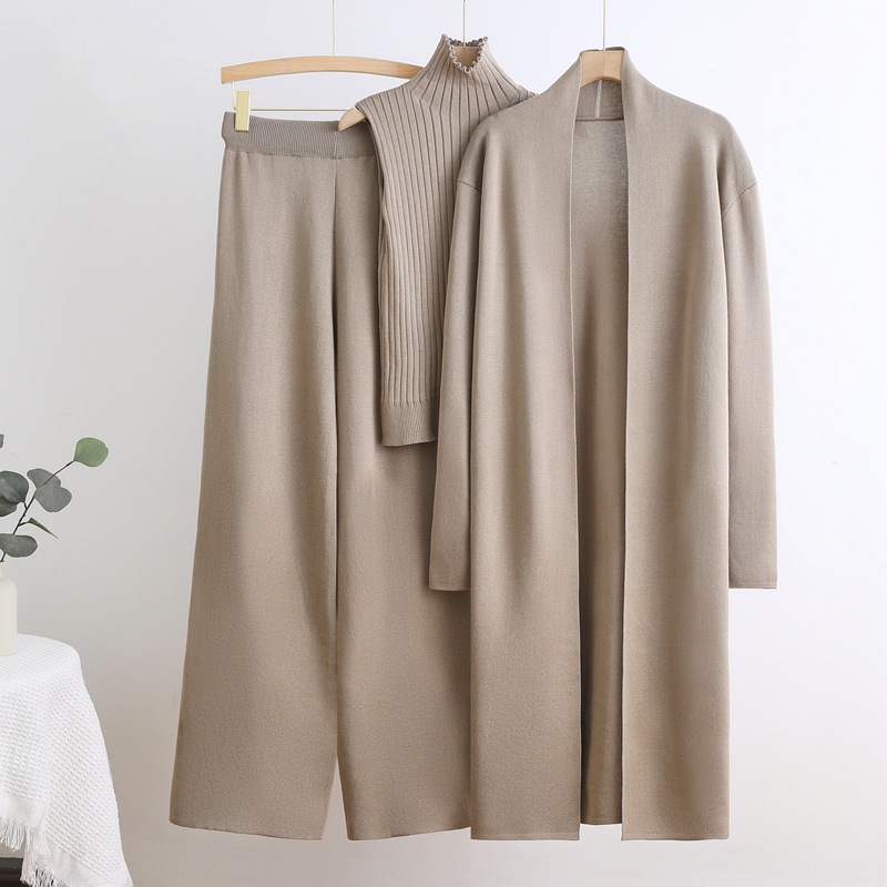 Autumn and winter goddess style long windbreaker, high neck, inner vest, sweater, elastic waist, wide leg pants, knitted three piece set Autumn and winter goddess style long windbreaker, high neck, inner vest, sweater, elastic waist, wide leg pants, knitted three piece set