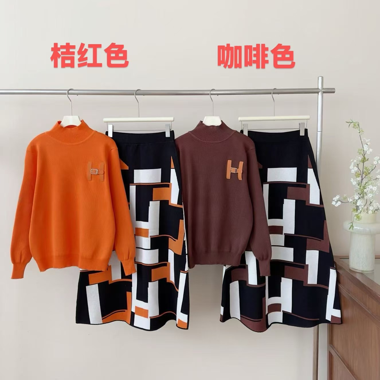 European fashion and high-end casual knitted sweater set for women's winter anti-aging letter half body long skirt two-piece set European fashion and high-end casual knitted sweater set for women's winter anti-aging letter half body long skirt two-piece set