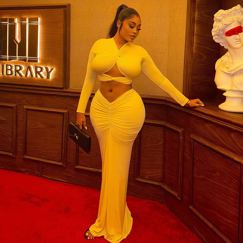 European and American style ins foreign trade bag buttocks temperament pleated personality skirt set with hollowed out exposed navel solid color V-neck two-piece set for women's clothing