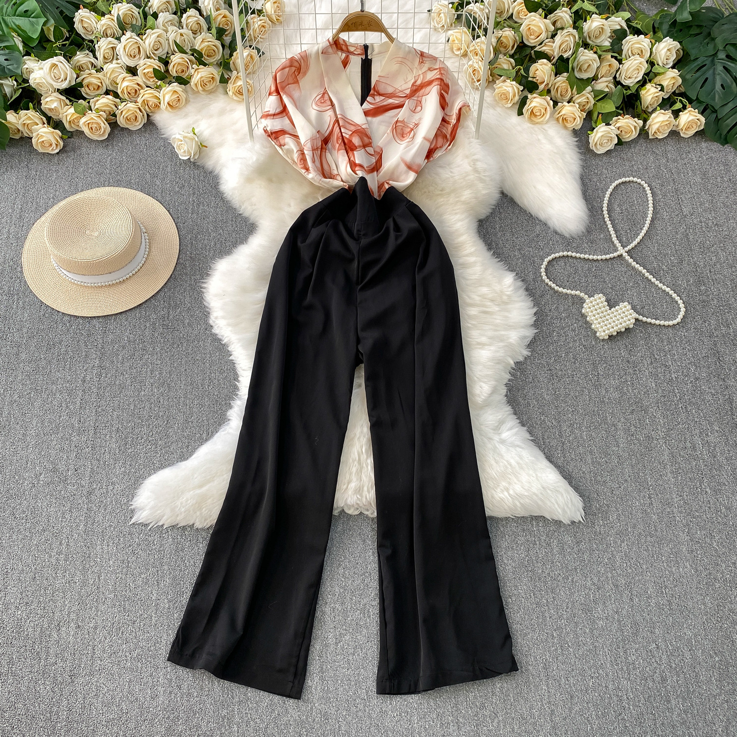 Advanced and elegant temperament print splicing V-neck short sleeved jumpsuit for women's summer new collection, waist cinching and slimming wide leg pants Advanced and elegant temperament print splicing V-neck short sleeved jumpsuit for women's summer new collection, waist cinching and slimming wide leg pants