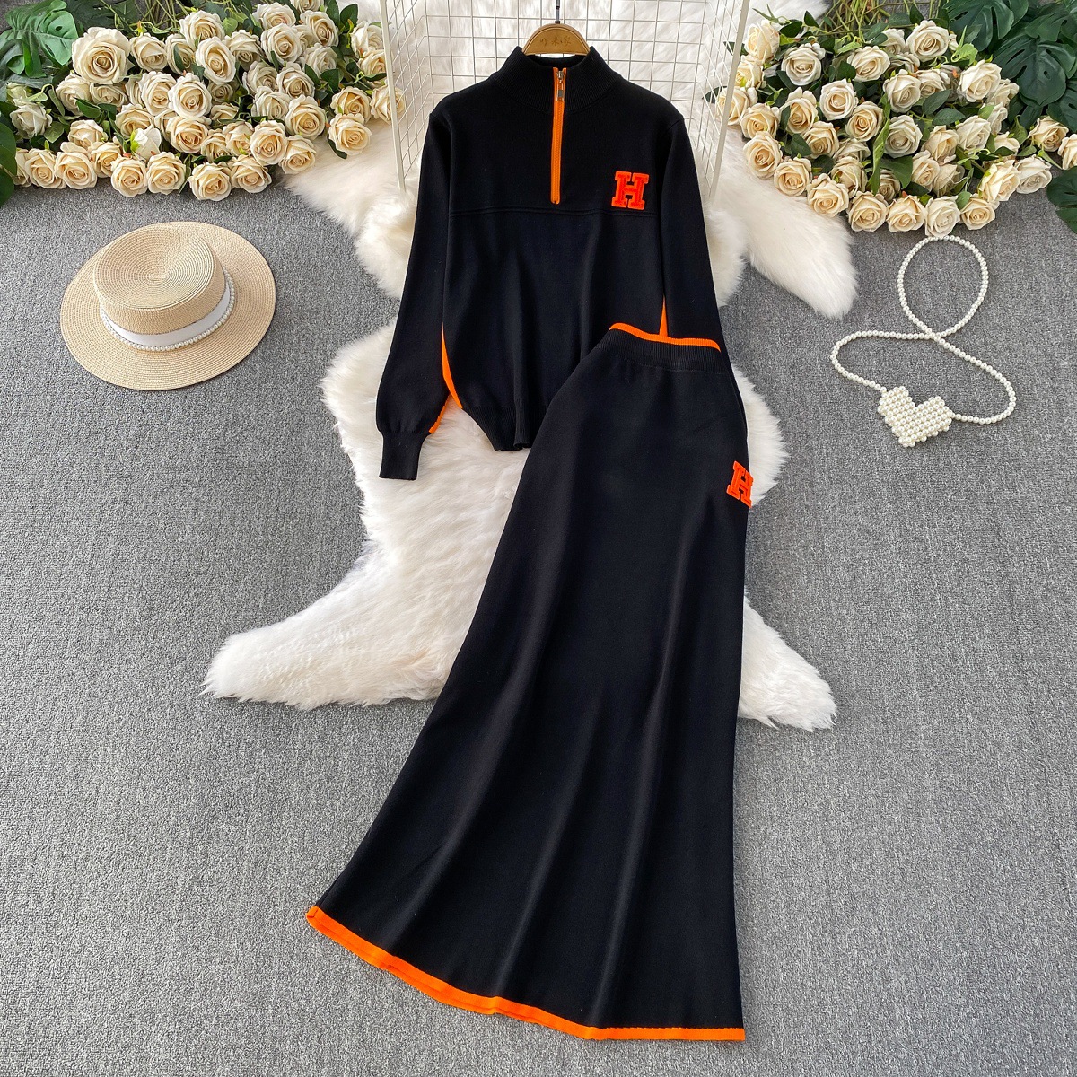 Autumn and winter slimming look, wearing a half high neck long sleeved knitted sweatshirt with a zipper and contrasting high waist mid length skirt set Autumn and winter slimming look, wearing a half high neck long sleeved knitted sweatshirt with a zipper and contrasting high waist mid length skirt set