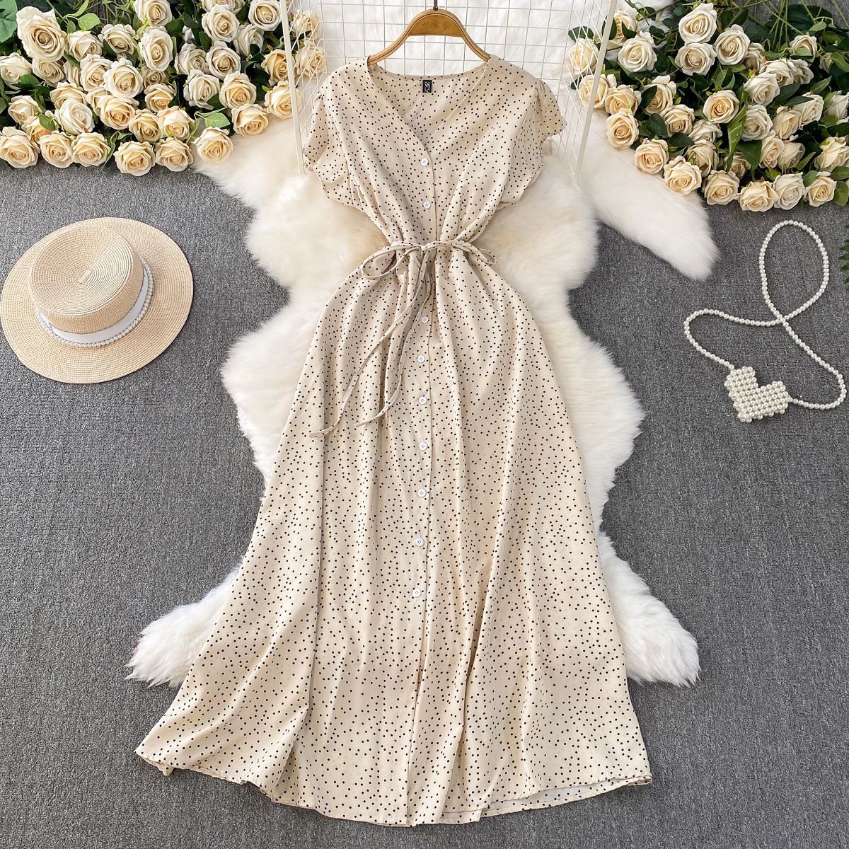 French red polka dot V-neck short sleeved dress for women in summer, with a single breasted buckle and tied waist for slimming effect. A-line medium length skirt French red polka dot V-neck short sleeved dress for women in summer, with a single breasted buckle and tied waist for slimming effect. A-line medium length skirt