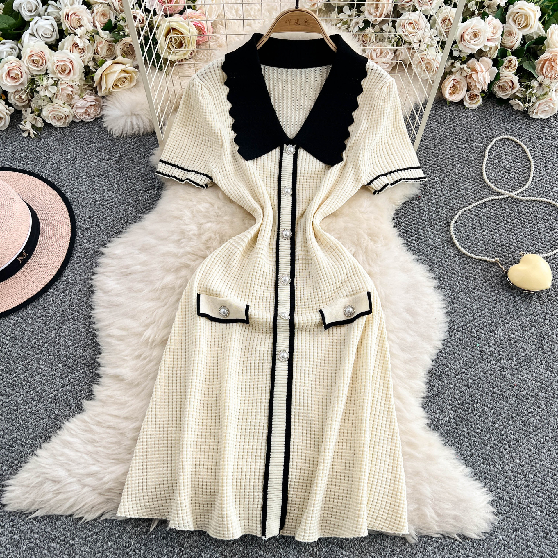 Temperament contrasting doll neck short sleeved knitted dress for women with a niche design sense, single breasted slim fit and slimming mid length skirt Temperament contrasting doll neck short sleeved knitted dress for women with a niche design sense, single breasted slim fit and slimming mid length skirt