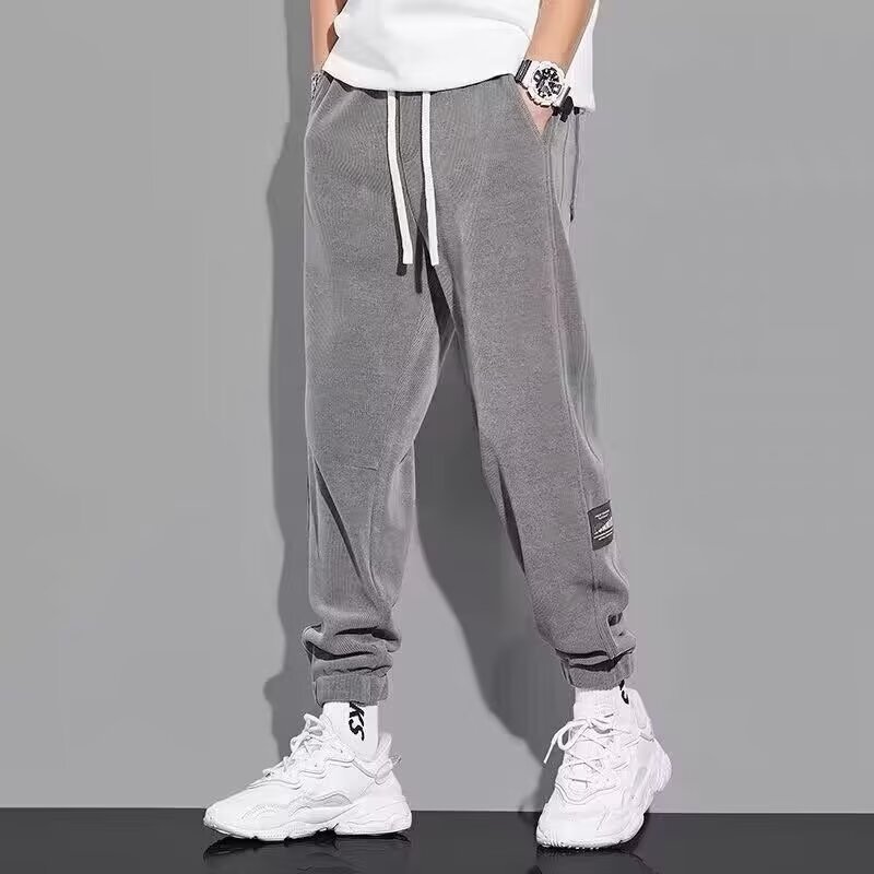 Loose fitting men's autumn new casual pants with bound feet, trendy drawstring pants for teenagers, versatile and sporty men