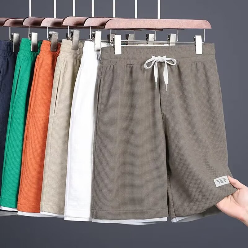 Clothing waffle five quarter pants men's summer new style Hong Kong style loose fitting straight tube color blocked fake two-piece shorts