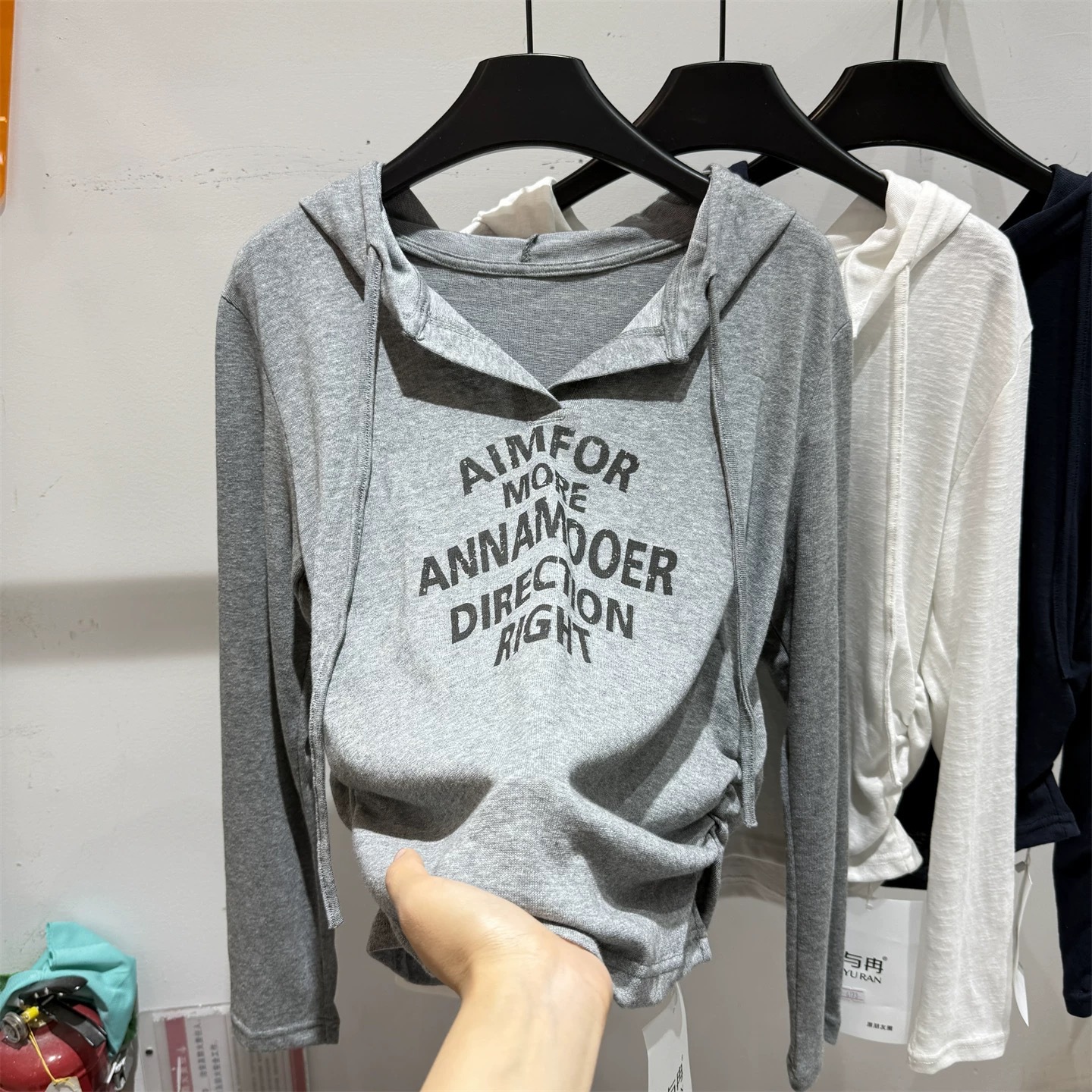 Autumn new fashion letter printed hooded long sleeved T-shirt for women, pleated top Autumn new fashion letter printed hooded long sleeved T-shirt for women, pleated top