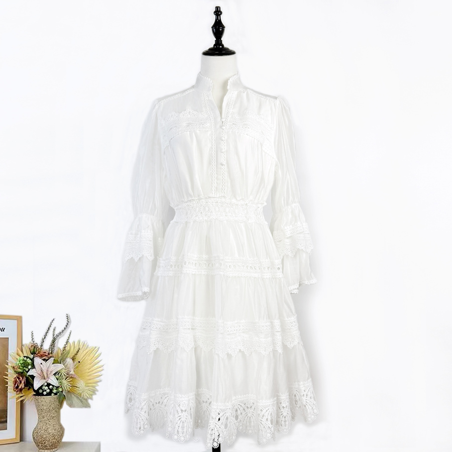 Realistic shooting of French elegant early autumn flared sleeves with heavy embroidery and hollow out vacation style dress, short lace skirt Realistic shooting of French elegant early autumn flared sleeves with heavy embroidery and hollow out vacation style dress, short lace skirt