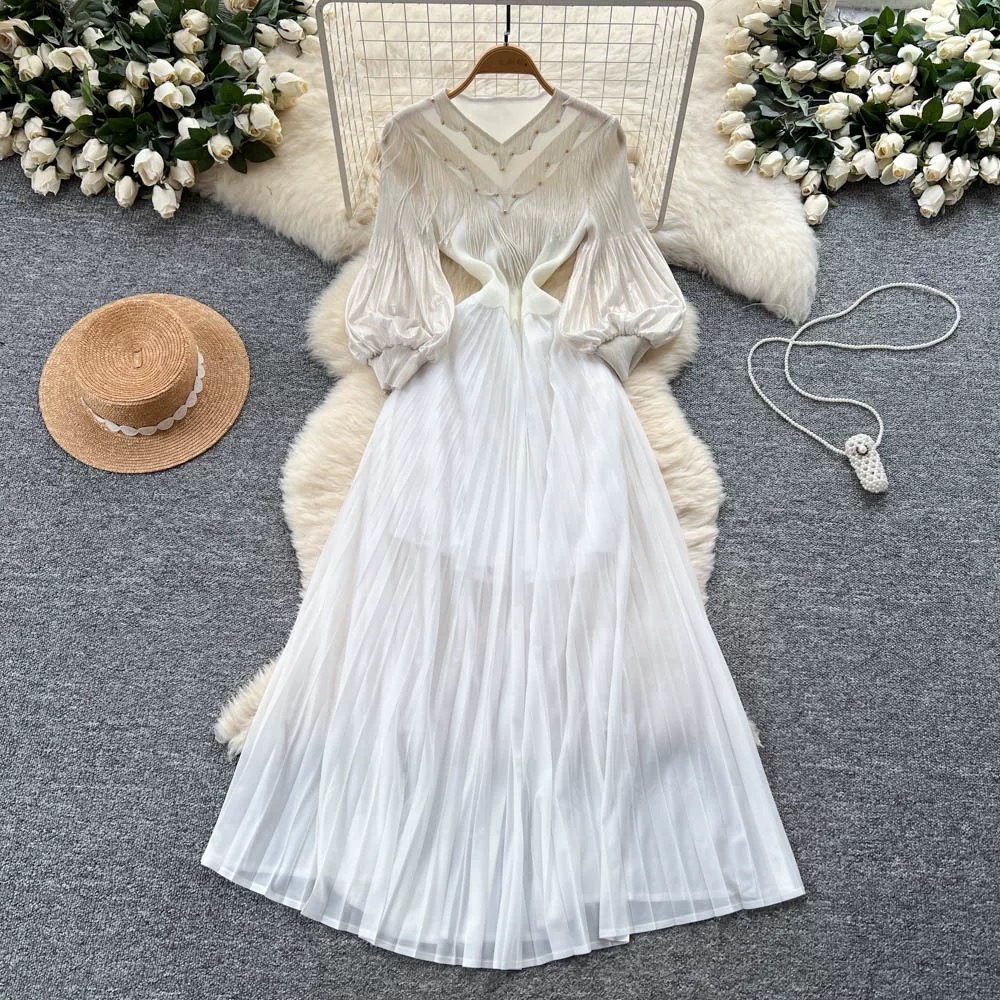 Ladies' court style bubble sleeve dress, light mature style, autumn tassel, hot stamping, pleated nail bead, large swing, women's long skirt Ladies' court style bubble sleeve dress, light mature style, autumn tassel, hot stamping, pleated nail bead, large swing, women's long skirt